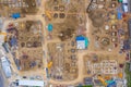 Aerial drone view of excavator loading the tipper truck at the construction site