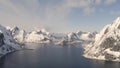 Aerial drone view of the famous winter Lofoten islands in Reine town in Norway.Kjerkfjorden fjord is know for its sharp peaks. Tou