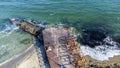 Aerial Drone View Flight Over Old Breakwater on Sandy Beach. Top View Waves Royalty Free Stock Photo