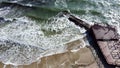 Aerial Drone View Flight Over Old Breakwater on Sandy Beach. Top View Waves Royalty Free Stock Photo