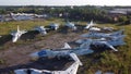 Aerial drone view flight over old rusty broken plane aircraft.