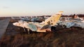 Aerial drone view flight over parking lot of old dismantled aircraft. Cemetery