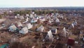 Aerial Drone View Flight Over small brick houses with plot of land in the middle