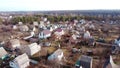 Aerial Drone View Flight Over small brick houses with plot of land in the middle