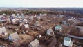 Aerial Drone View Flight Over small brick houses with plot of land in the middle