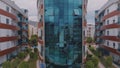 Aerial drone view of the glass facade of the hotel. Vacation at the resort. Modern architecture.