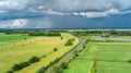 Aerial drone view of green fields and farm houses near canal, typical Dutch landscape, Holland, Netherlands Royalty Free Stock Photo