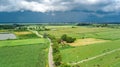 Aerial drone view of green fields and farm houses near canal from above, typical Dutch landscape, Holland, Netherlands Royalty Free Stock Photo