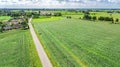 Aerial drone view of green fields and farm houses near canal from above, typical Dutch landscape, Holland, Netherlands Royalty Free Stock Photo
