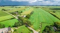 Aerial drone view of green fields and farm houses near canal, typical Dutch landscape, Holland, Netherlands Royalty Free Stock Photo