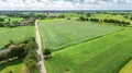 Aerial drone view of green fields and farm houses near canal, typical Dutch landscape, Holland, Netherlands Royalty Free Stock Photo