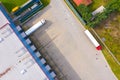 Aerial drone view of group of large modern industrial warehouse or factory buildings in suburban city area.Logistic transportation Royalty Free Stock Photo