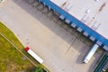 Aerial drone view of group of large modern industrial warehouse or factory buildings in suburban city area.Logistic transportation Royalty Free Stock Photo