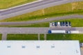 Aerial drone view of group of large modern industrial warehouse or factory buildings in suburban city area.Logistic transportation Royalty Free Stock Photo