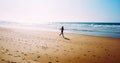 Aerial Drone View Of Healthy Sportive Woman Running On Beach