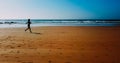 Aerial Drone View Of Healthy Sportive Woman Running On Beach