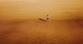 Aerial Drone View Of Healthy Sportive Woman Running On Beach