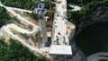 Aerial drone view on highway bridge road under construction. Construction of the viaduct on the modern new road. Royalty Free Stock Photo