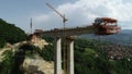 Aerial drone view on highway bridge road under construction. Construction of the viaduct on the modern new road. Royalty Free Stock Photo