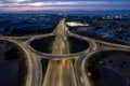 Aerial drone view of highway junction. Roundabout cars moving fast. Transportation infrastructure Royalty Free Stock Photo