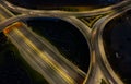 Aerial drone view of highway junction. Roundabout cars moving fast. Transportation infrastructure Royalty Free Stock Photo