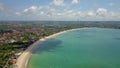 Aerial drone view of Holiday In Sanur Beach, Bali, Indonesia with ocean, boats, beach, villas, and people. Royalty Free Stock Photo