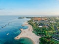 Aerial drone view of Holiday In Sanur Beach, Bali, Indonesia with ocean, boats, beach, villas, and people Royalty Free Stock Photo
