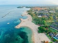 Aerial drone view of Holiday In Sanur Beach, Bali, Indonesia with ocean, boats, beach, villas, and people Royalty Free Stock Photo