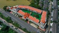 Aerial drone view of hotel with red color of the roof and the swimming pool inside the hotel. Hotel in Ko Kaeo, Phuket Royalty Free Stock Photo