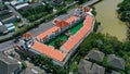 Aerial drone view of hotel with red color of the roof and the swimming pool inside the hotel. Hotel in Ko Kaeo, Phuket Royalty Free Stock Photo