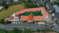 Aerial drone view of hotel with red color of the roof and the swimming pool inside the hotel. Hotel in Ko Kaeo, Phuket Royalty Free Stock Photo