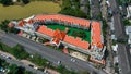 Aerial drone view of hotel with red color of the roof and the swimming pool inside the hotel. Hotel in Ko Kaeo, Phuket Royalty Free Stock Photo