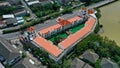 Aerial drone view of hotel with red color of the roof and the swimming pool inside the hotel. Hotel in Ko Kaeo, Phuket Royalty Free Stock Photo