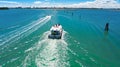 Aerial drone view of houseboat in Venetian lagoon, family travel cruise by vacation boat in Italy