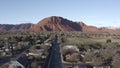 Aerial Drone view of Ivins St George in Utah on a bright sunny winter day showing city in front of red mountains and red cliff nat