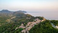 Sunset over coast of Corfu with Pelekas village, Greece Royalty Free Stock Photo