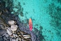 Aerial drone view of in kayak in crystal clear lagoon sea water during summer day near Koh Lipe island in Thailand. Royalty Free Stock Photo