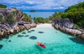 Aerial drone view of in kayak in crystal clear lagoon sea water during summer day near Koh Lipe island in Thailand. Royalty Free Stock Photo