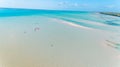 Aerial drone view of kite surfing lovers enjoying the sea in Jambiani Zanzibar