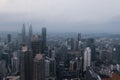 Aerial view of Kuala Lumpur city skyline during cloudy day