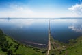 Aerial drone view of lake landscape with road