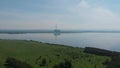 Aerial drone view of lake landscape with road