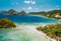 Aerial drone view of Las Cabanas sunny beach in El Nido, Palawan