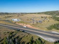 Aerial drone view of Lincoln Memorial rest stop on Interstate 80 near Laramie Wyoming under blue sky