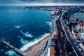 Aerial drone view of Marginal Avenue and coastline with looking west towards Cascais on a cloudy autumn day