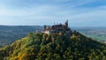 Aerial drone view of medieval Hohenzollern castle on top of hill in autumn, Baden-Wurttemberg, Germany. Royalty Free Stock Photo