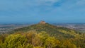 Aerial drone view of medieval Hohenzollern castle on top of hill in autumn, Baden-Wurttemberg, Germany. Royalty Free Stock Photo