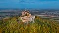 Aerial drone view of medieval Hohenzollern castle on top of hill in autumn, Baden-Wurttemberg, Germany. Royalty Free Stock Photo