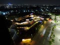 Aerial drone view of modern building in Jakarta central business district at night with Jakarta cityscape. JAKARTA. INDONESIA - Royalty Free Stock Photo