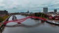 Aerial drone view of modern footbridge Python Bridge at Eastern Docklands neighborhood of Amsterdam Netherlands Royalty Free Stock Photo